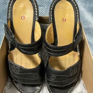 Clarks black wedge mules. Size 9